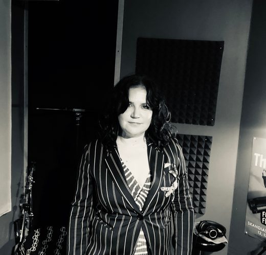 Artist laughing in studio